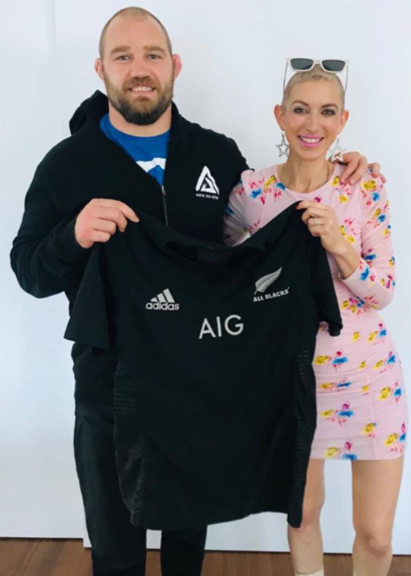 Owen Franks and Missy Terpstra with the jersey. Photo: NZ Herald