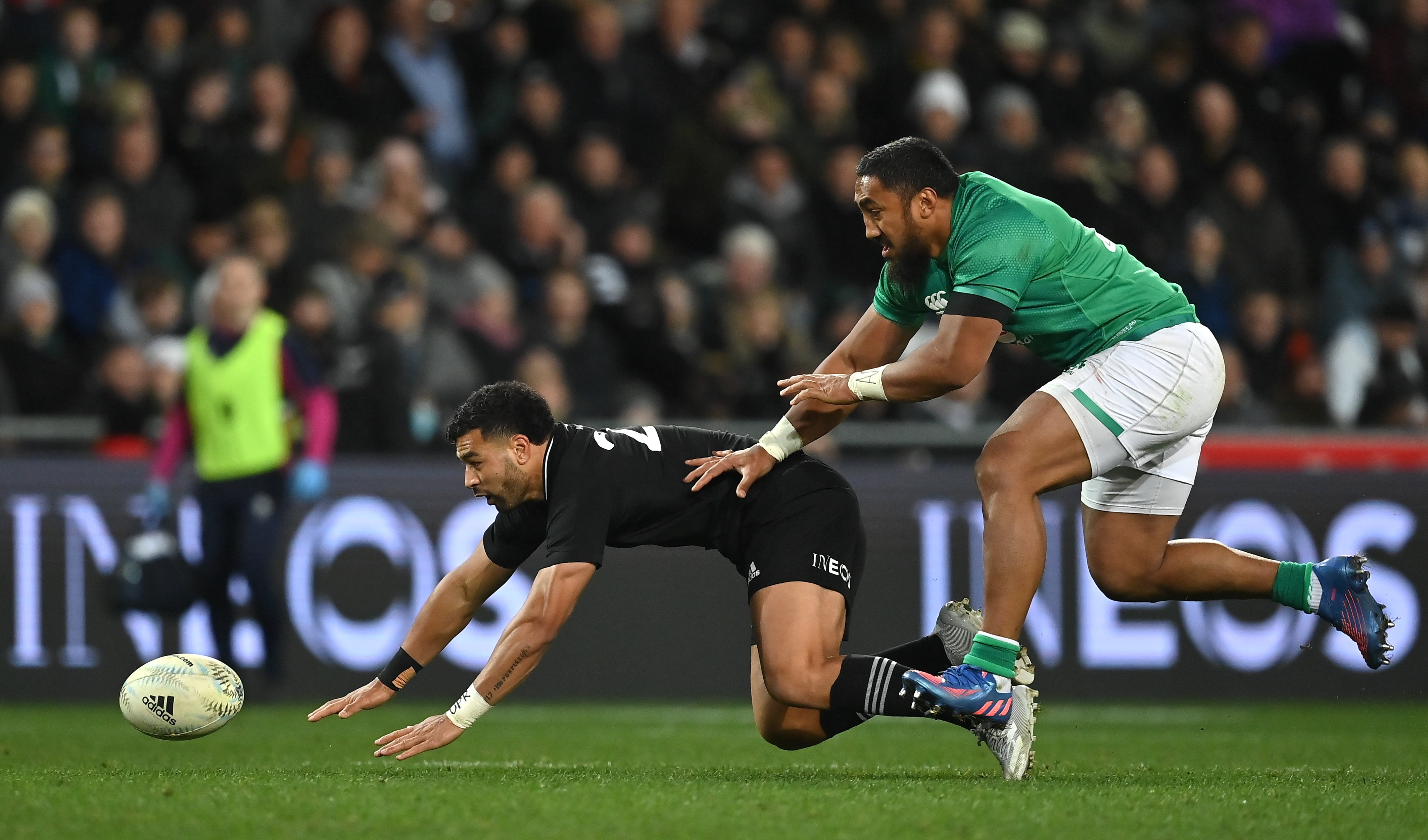 All Black first-five Richie Mo'unga is tackled by Ireland's Bundee Aki in the Dunedin test. Photo...