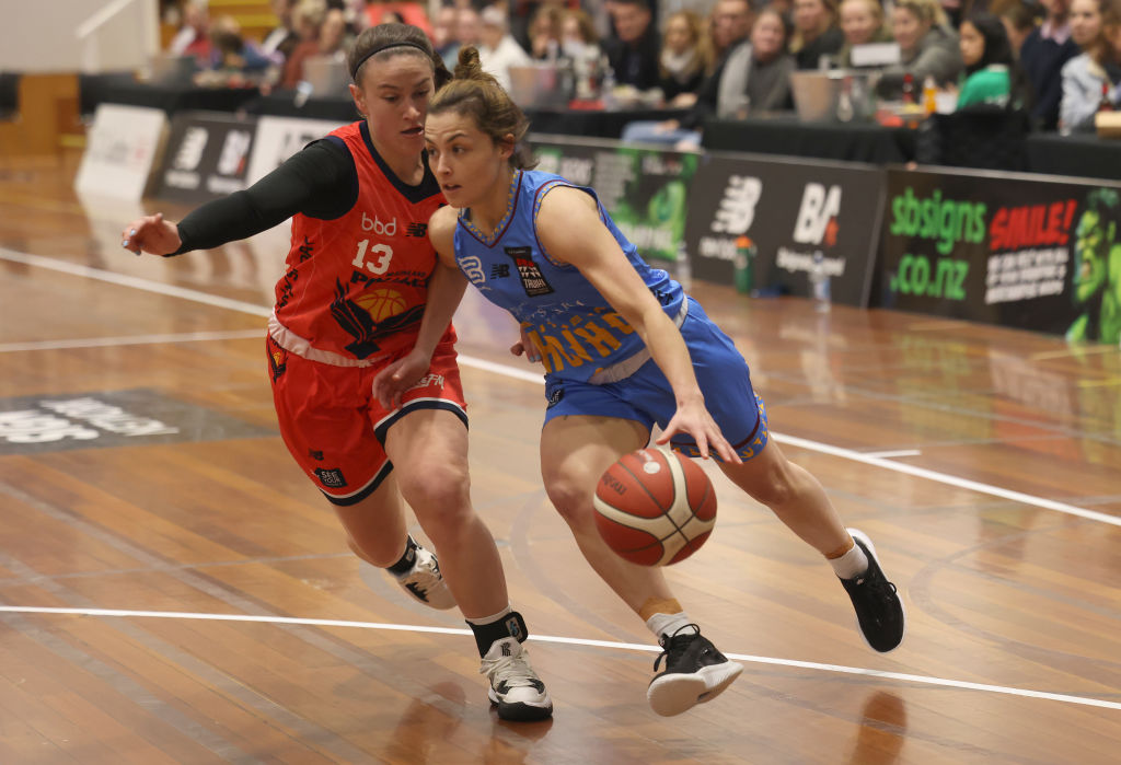 Southern Hoiho point guard Tori Dugan drives to the hoop as Mainland Pouakai guard Sierra Walker...