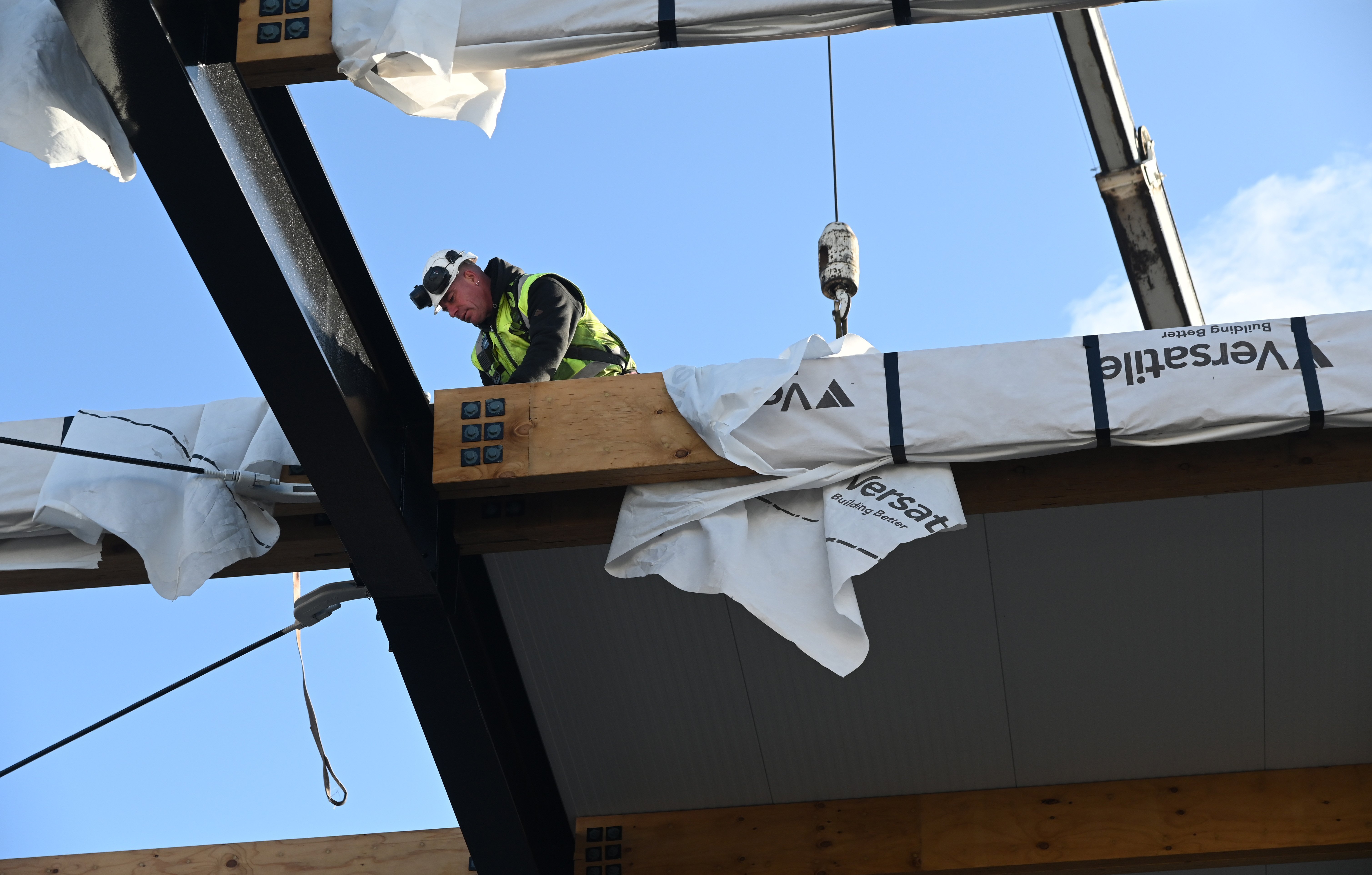 Reece Kemp installs roofing panel at the new Mosgiel Pool. PHOTO: ALLIED PRESS FILES 