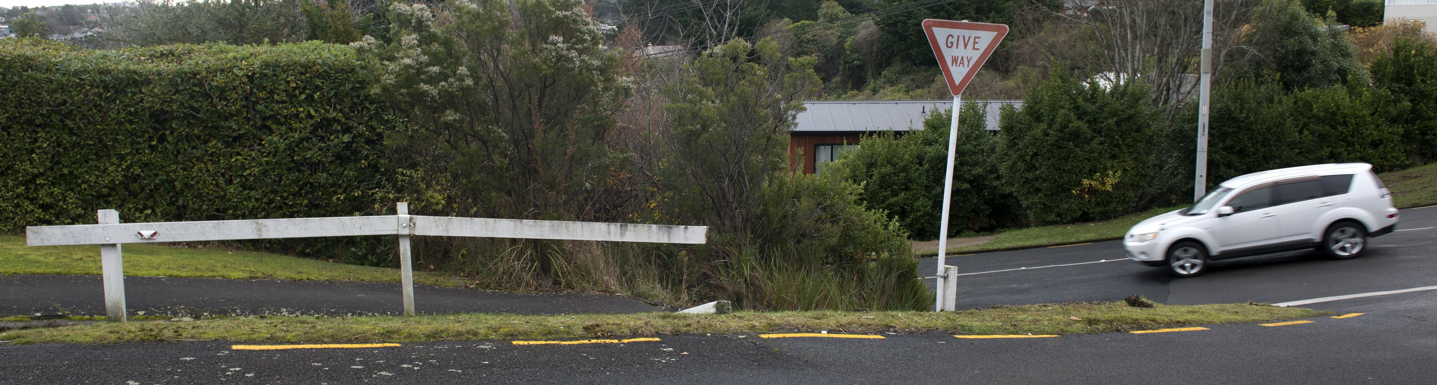 The give way sign at the intersection of Fea and Orbell Sts has been re-erected but the barrier...