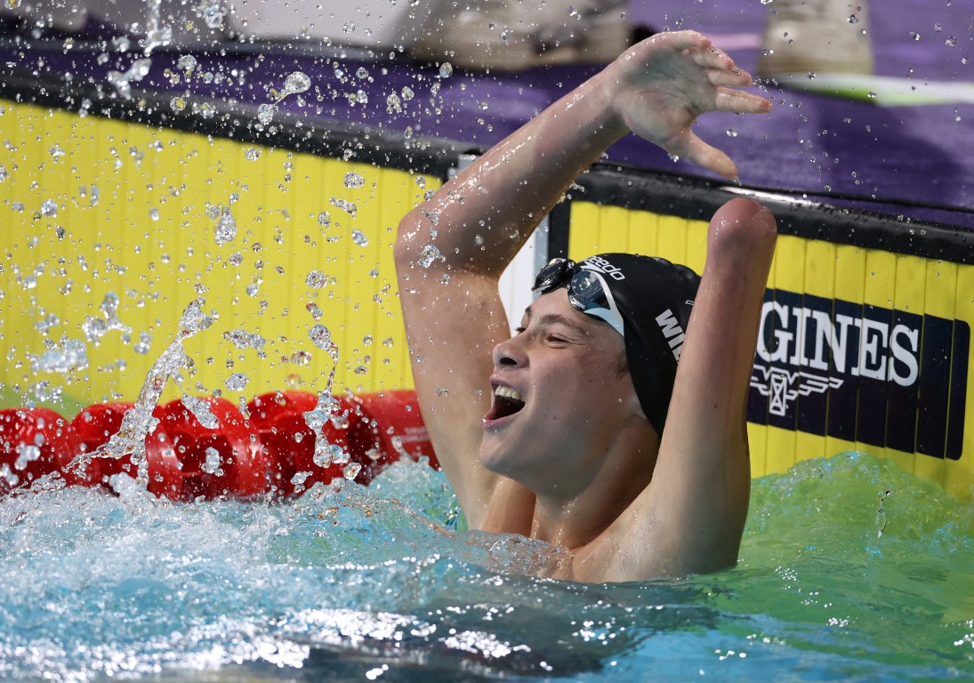 New Zealand's Joshua Willmer celebrates his victory in the Men's 100m Breaststroke final. Photo:...