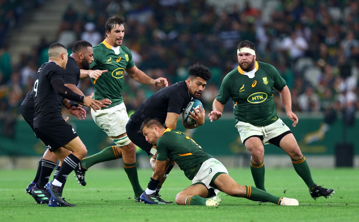 New Zealand's Ardie Savea is caught by the South African defence, Photo: Reuters