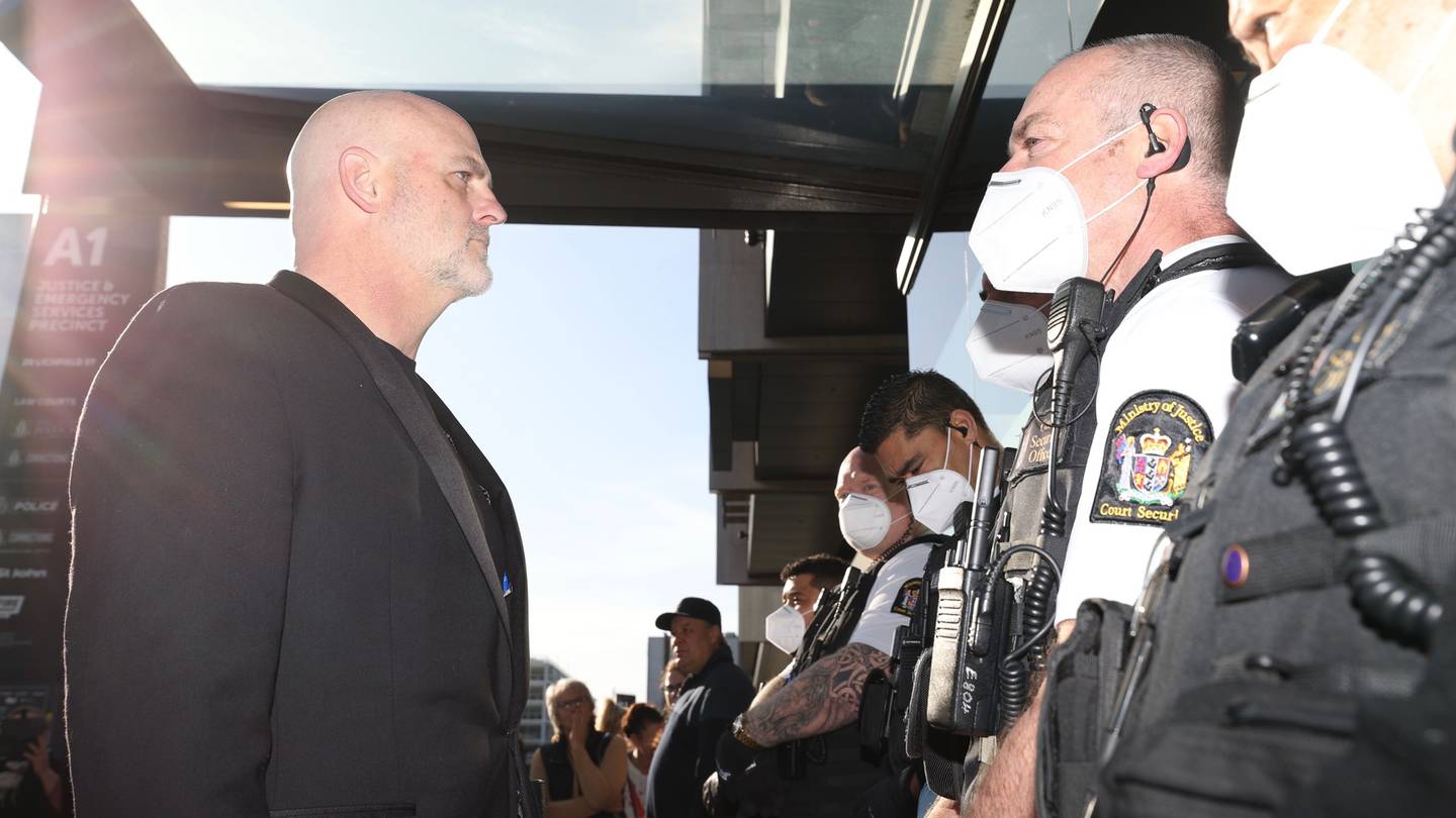 Kelvyn Alp faces off with security outside the Christchurch District Court this morning. Photo:...