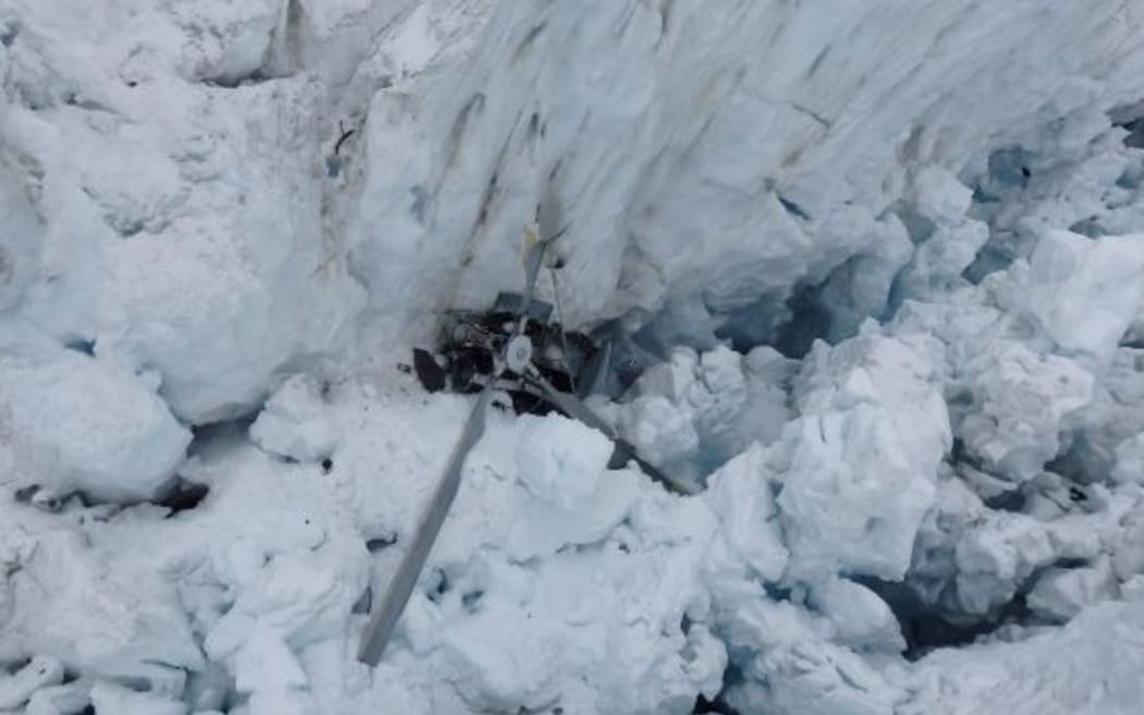 The helicopter wreckage on Fox Glacier in 2015. Photo: NZ Police