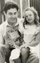 Gavin Bishop with his daughter Alexandra and his book Chicken Licken in 1984. PHOTO: CCL