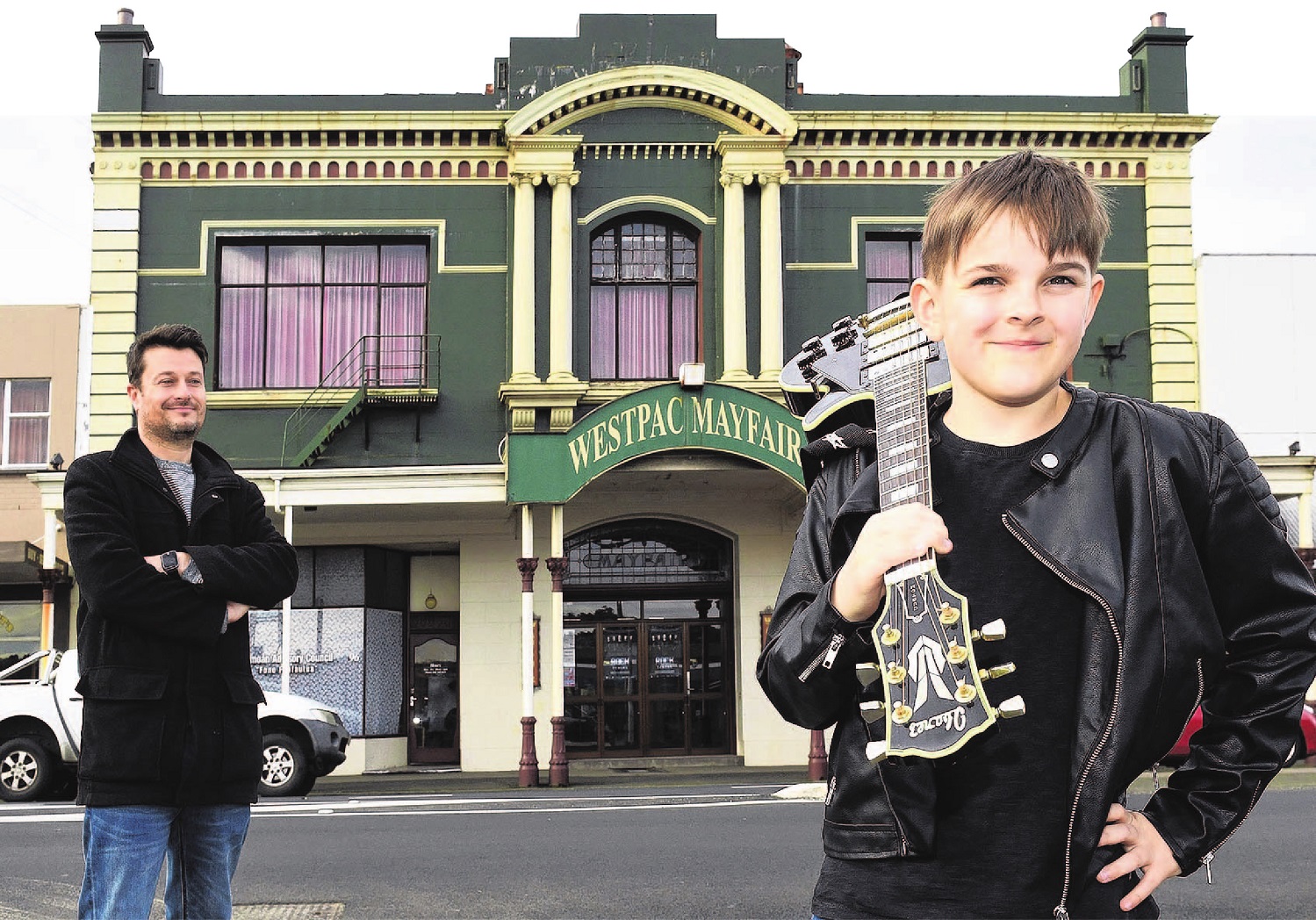 Eddie Platt struts his stuff with tutor and Rock Tenors band guitarist Che Long outside the...