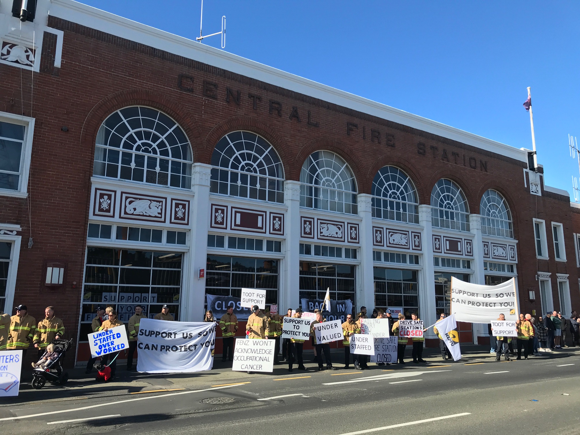 Firefighters outside the Dunedin Station during the one-hour protest this morning. PHOTO: GREGOR...