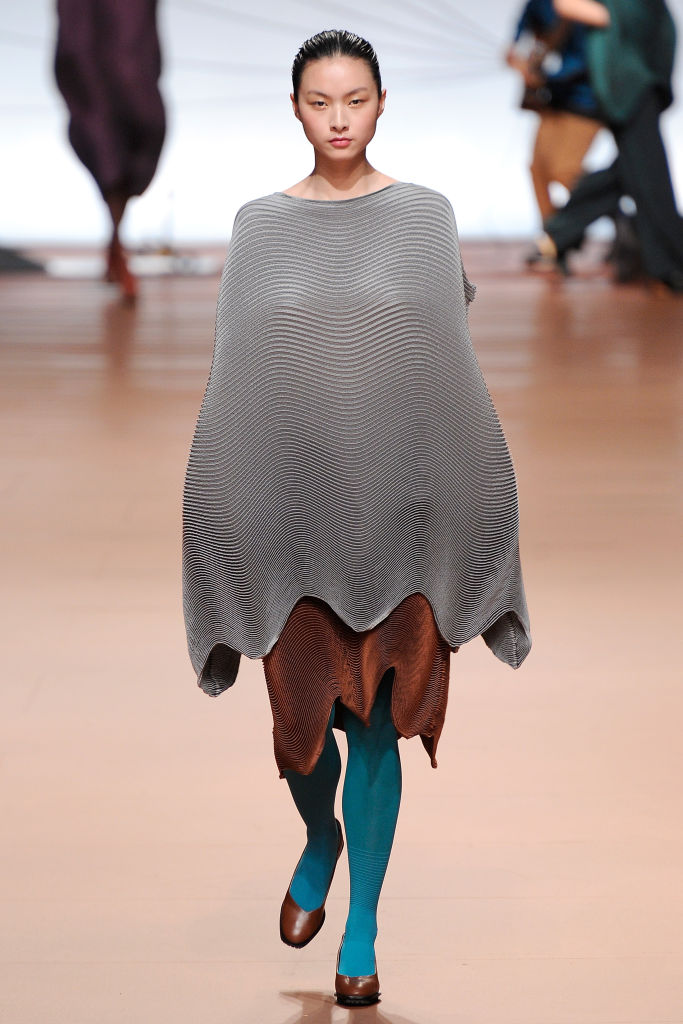 Issey Miyake developed a new way of pleating by wrapping fabrics between layers of paper and...