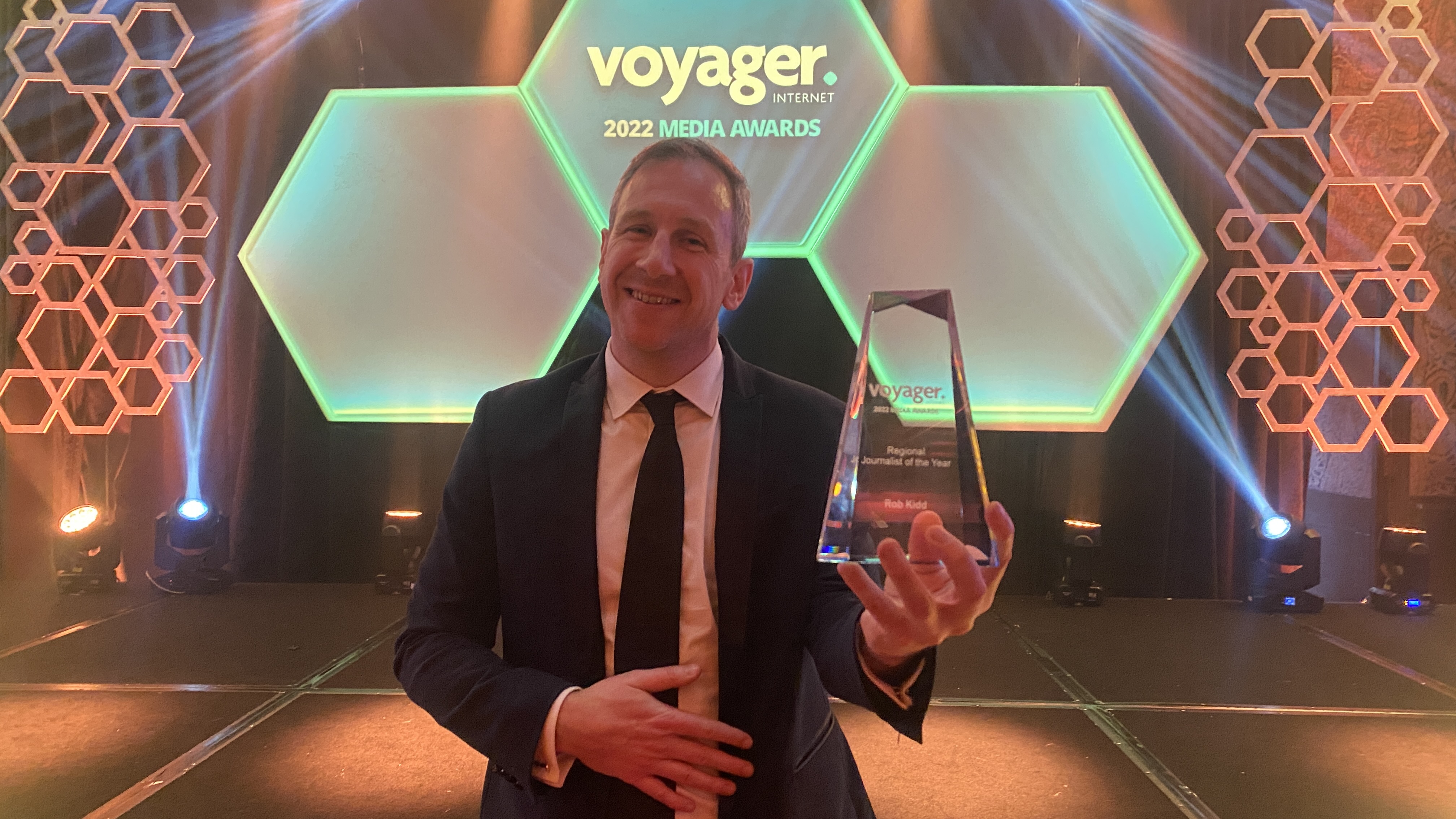 ODT court reporter Rob Kidd with his award for Regional Journalist of the Year. Photo: Craig Baxter