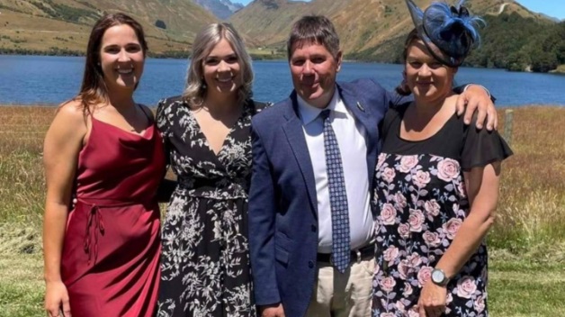 Tim Gibb with his wife and daughters. Photo: Givealittle