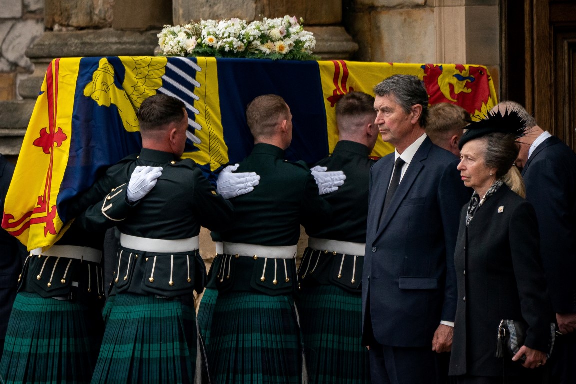 Vice Admiral Timothy Laurence and Princess Anne observe as the coffin of Queen Elizabeth II,...