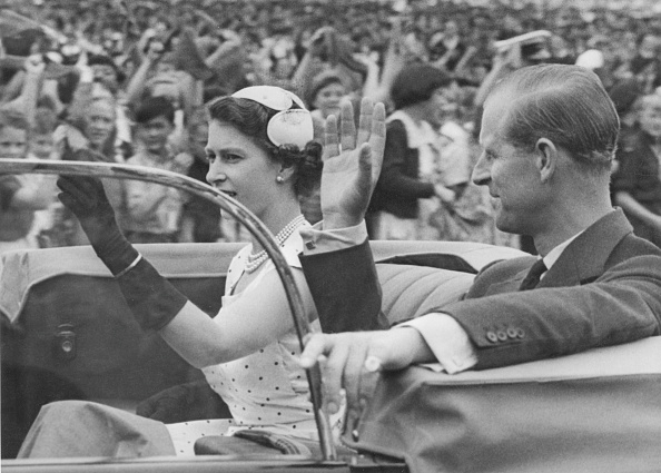 Queen Elizabeth II and Prince Philip returning to Government House after attending a youth rally...