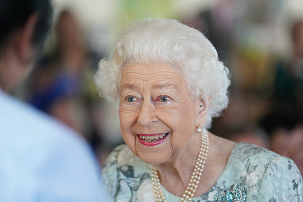 Queen Elizabeth II smiles during a visit to officially open the new building at Thames Hospice on...
