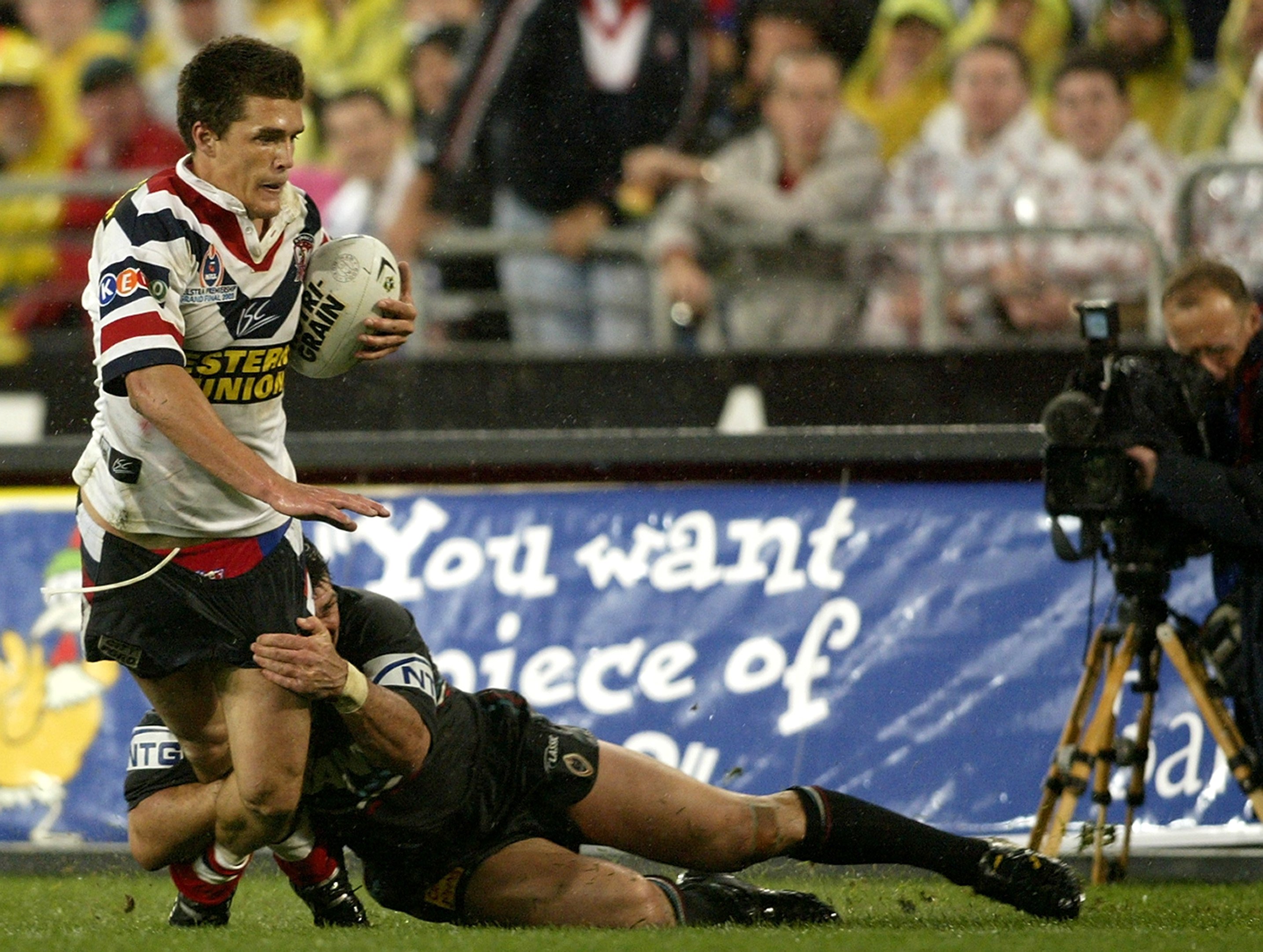 Sattler shuts down Roosters winger Todd Byrne during the 2003 NRL grand final. PHOTO: GETTY IMAGES