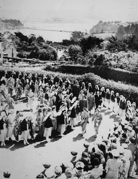 Nurses line the drive to Karitane Hospital at Anderson's Bay, Dunedin, as the Queen arrives for a...