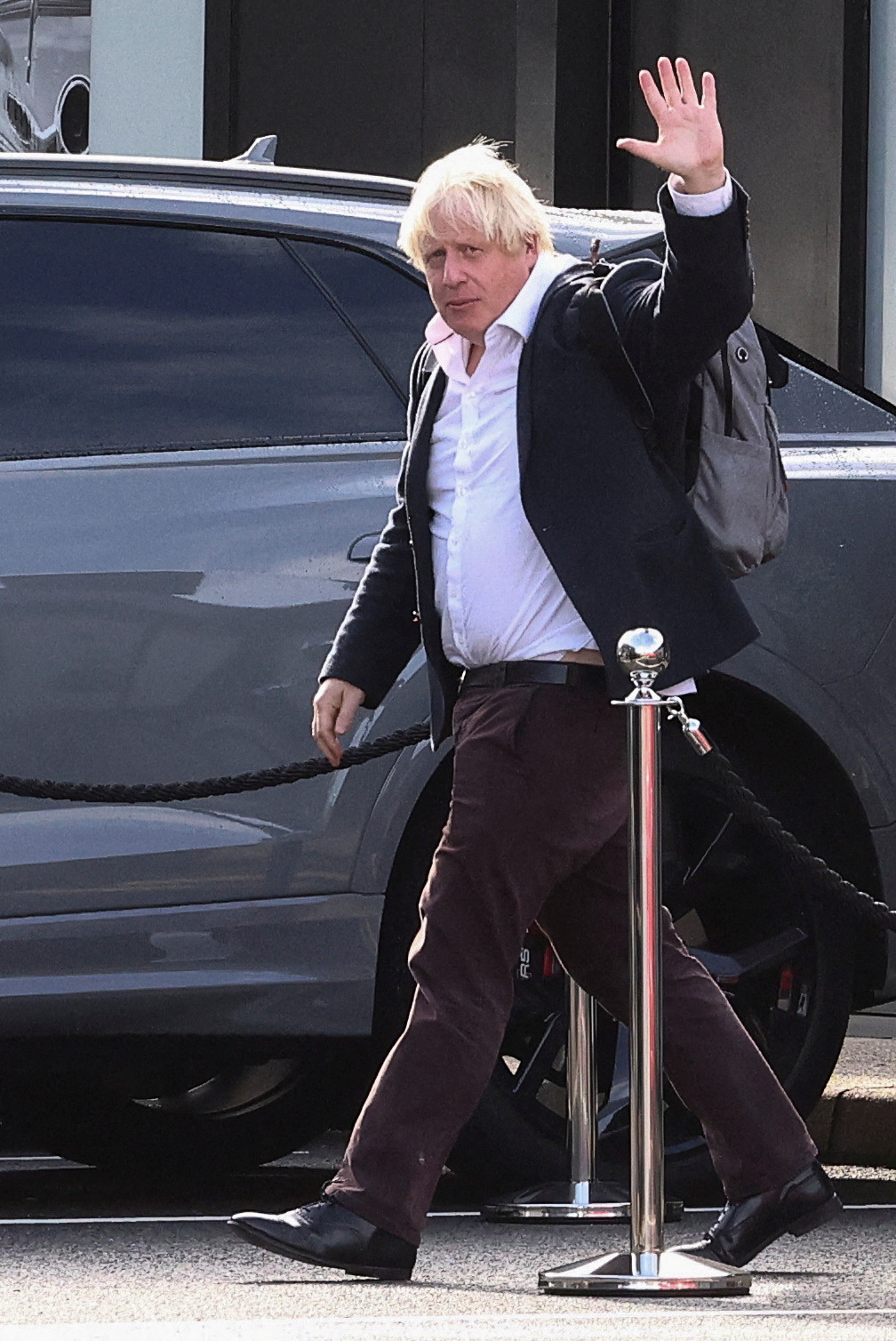 Former British Prime Minister Boris Johnson gestures, at Gatwick Airport, near London, on...