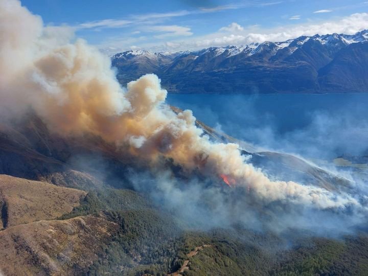 A fire burns in steep terrain on Mt Creighton. PHOTOS: FIRE AND EMERGENCY NEW ZEALAND