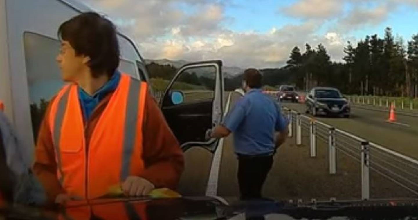The man takes his opportunity to move a protest van blocking the road.