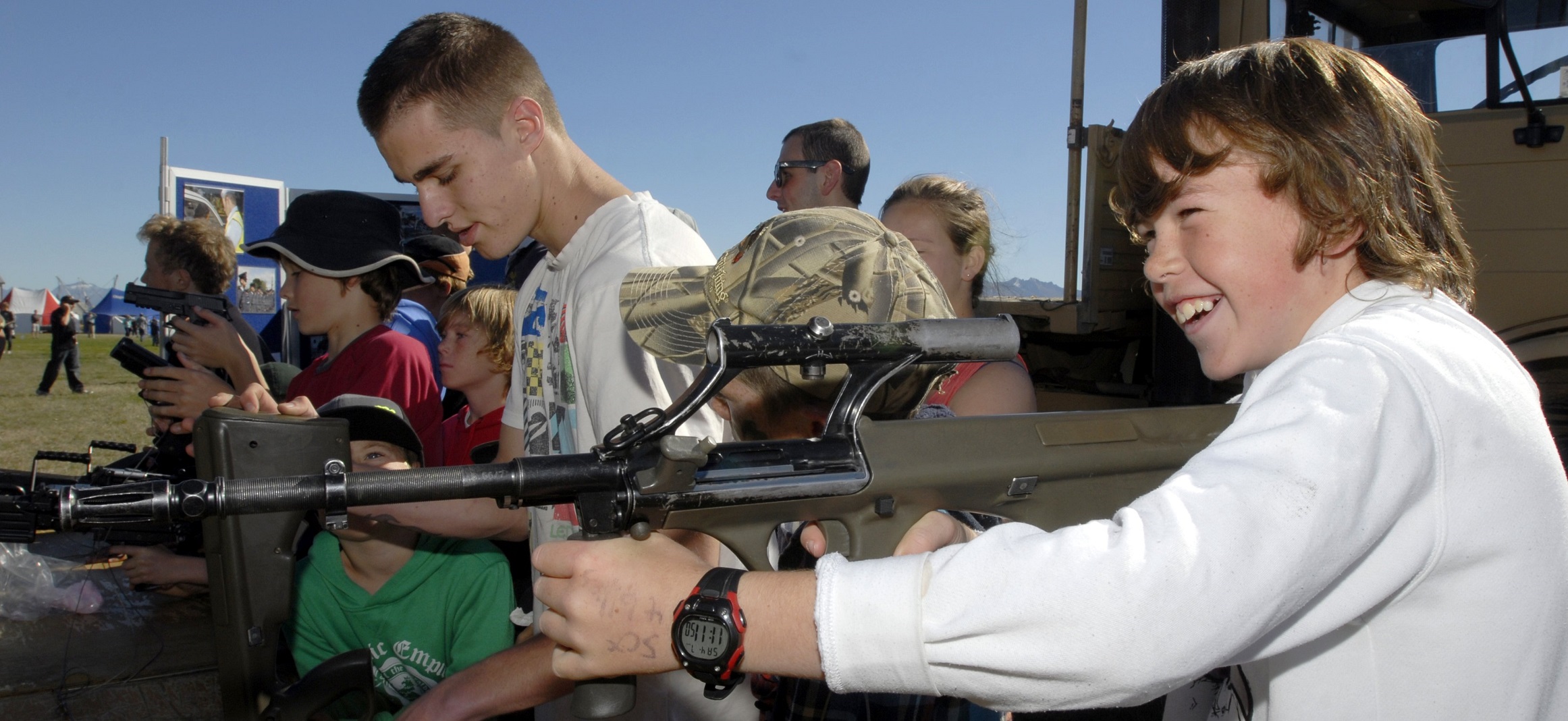 Tate Barron, of Dunedin, tries on a Steyr assault rifle for size at a NZ Defence Force display...