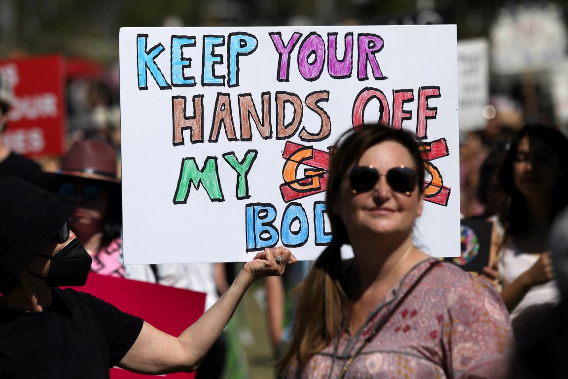 An abortion rights protester holds a sign during a rally in Los Angeles, California. Photo: Reuters