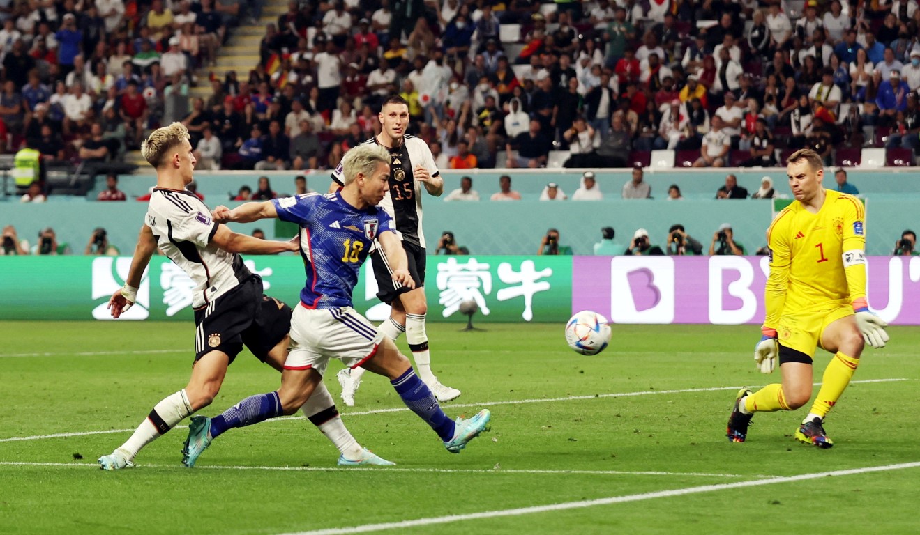 Japan's Takuma Asano scores their second goal against Germany. Photo: Reuters