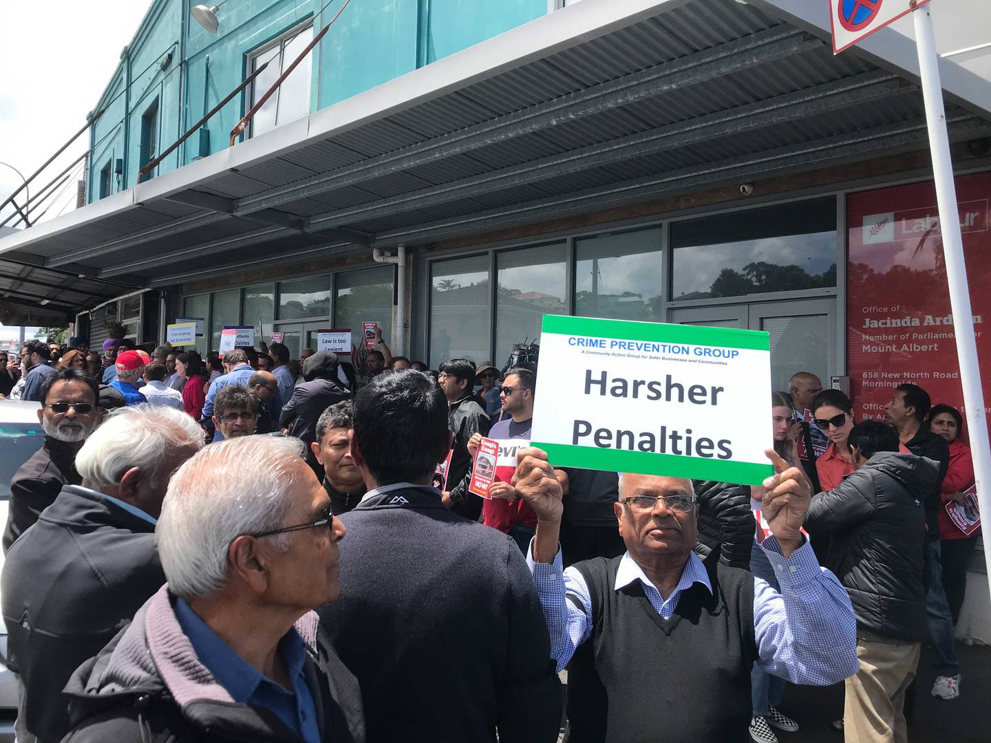 Shopkeepers protest outside Jacinda Ardern's electorate office in Auckland. Photo: Joey Dwyer