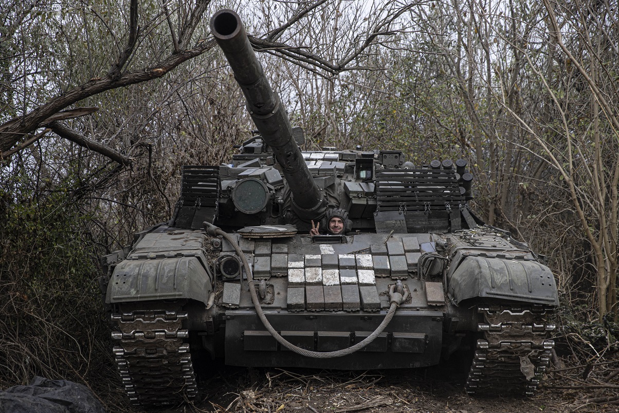 A Ukrainian soldier shows a V sign from a tank as Ukrainian Armed Forces continue towards Kherson...