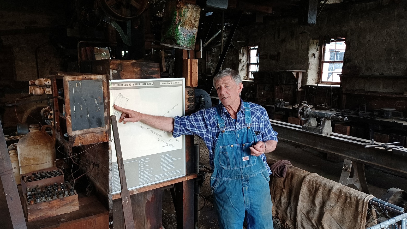 Hayes Engineering volunteer Ken Gillespie leads an operational tour at the Hayes workshop last...