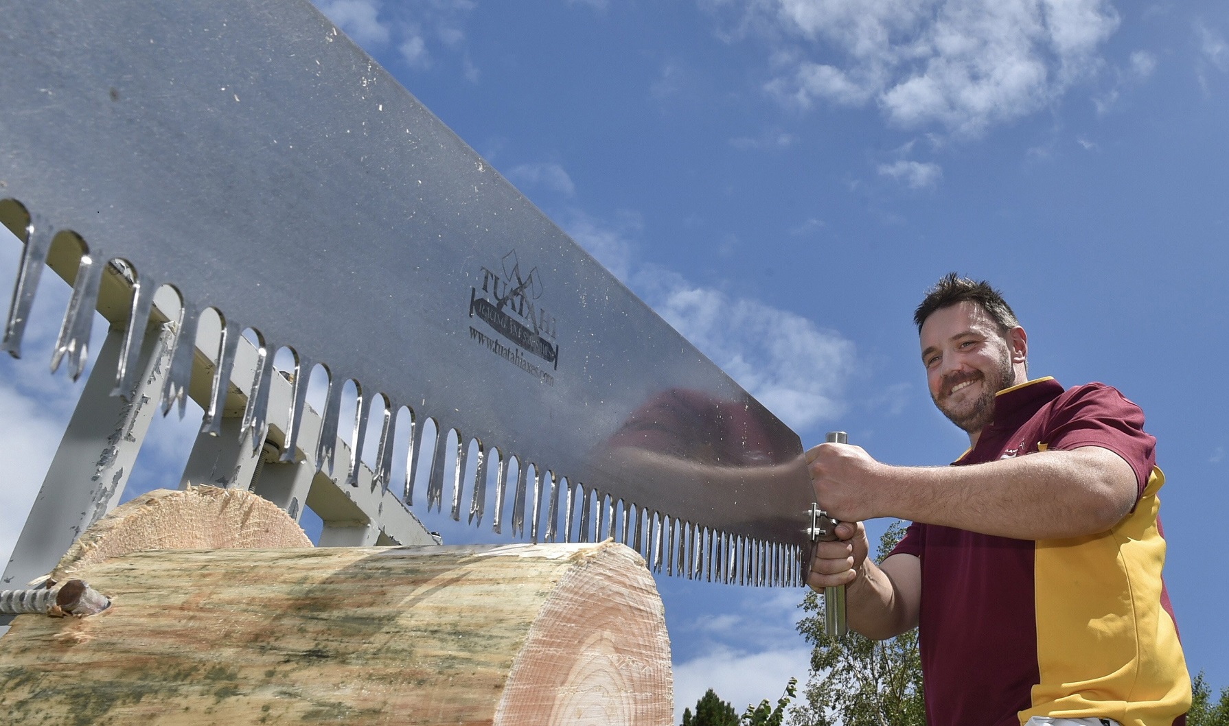 Simon Bond, of Otautau, readies his saw for a heat of the handicapped cross-cut saw race at the...