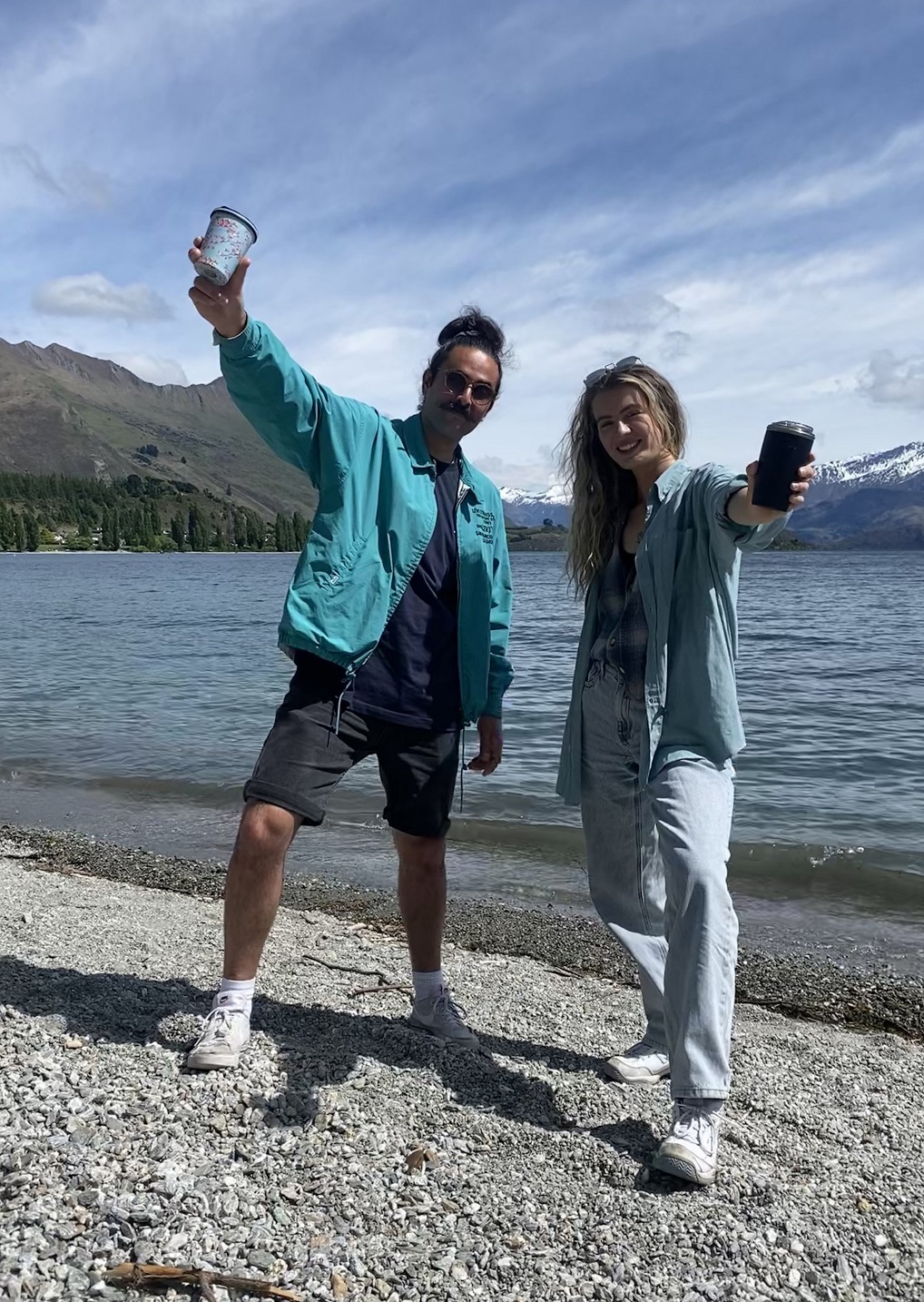 Hemi Cordell and Catrin Smith take their coffee and reusable cups down to the lake in Wanaka....