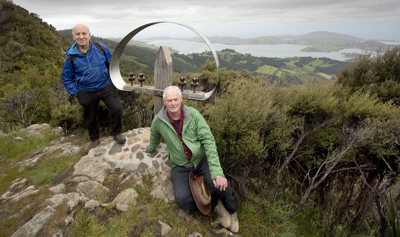 Jim McQuillan (left) and Stuart Griffiths rest beside "New Zealand’s least visited piece of...