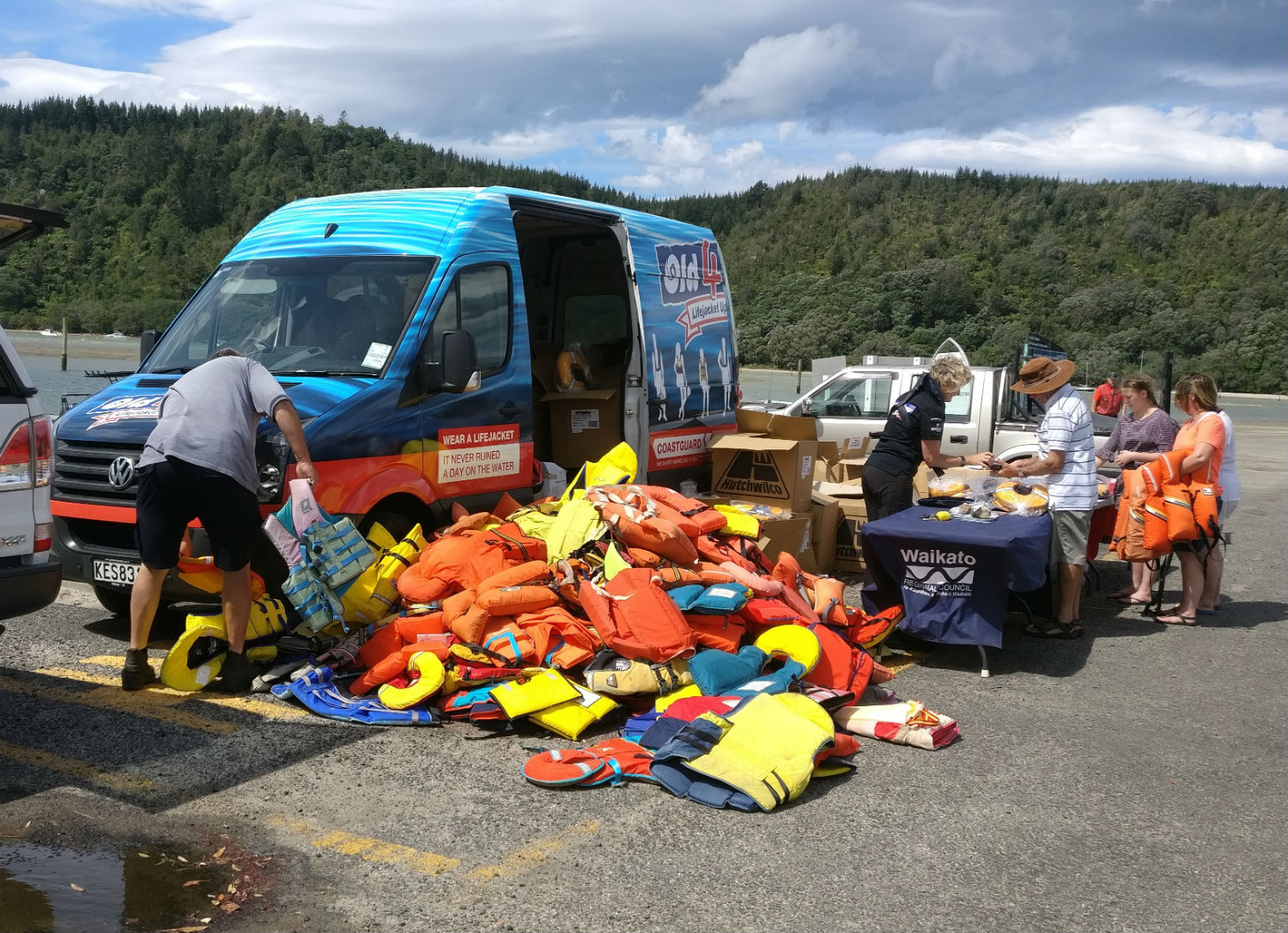 Saving lives . . . Members of the Coast Guard's Old 4 New lifejacket upgrade campaign spend time...