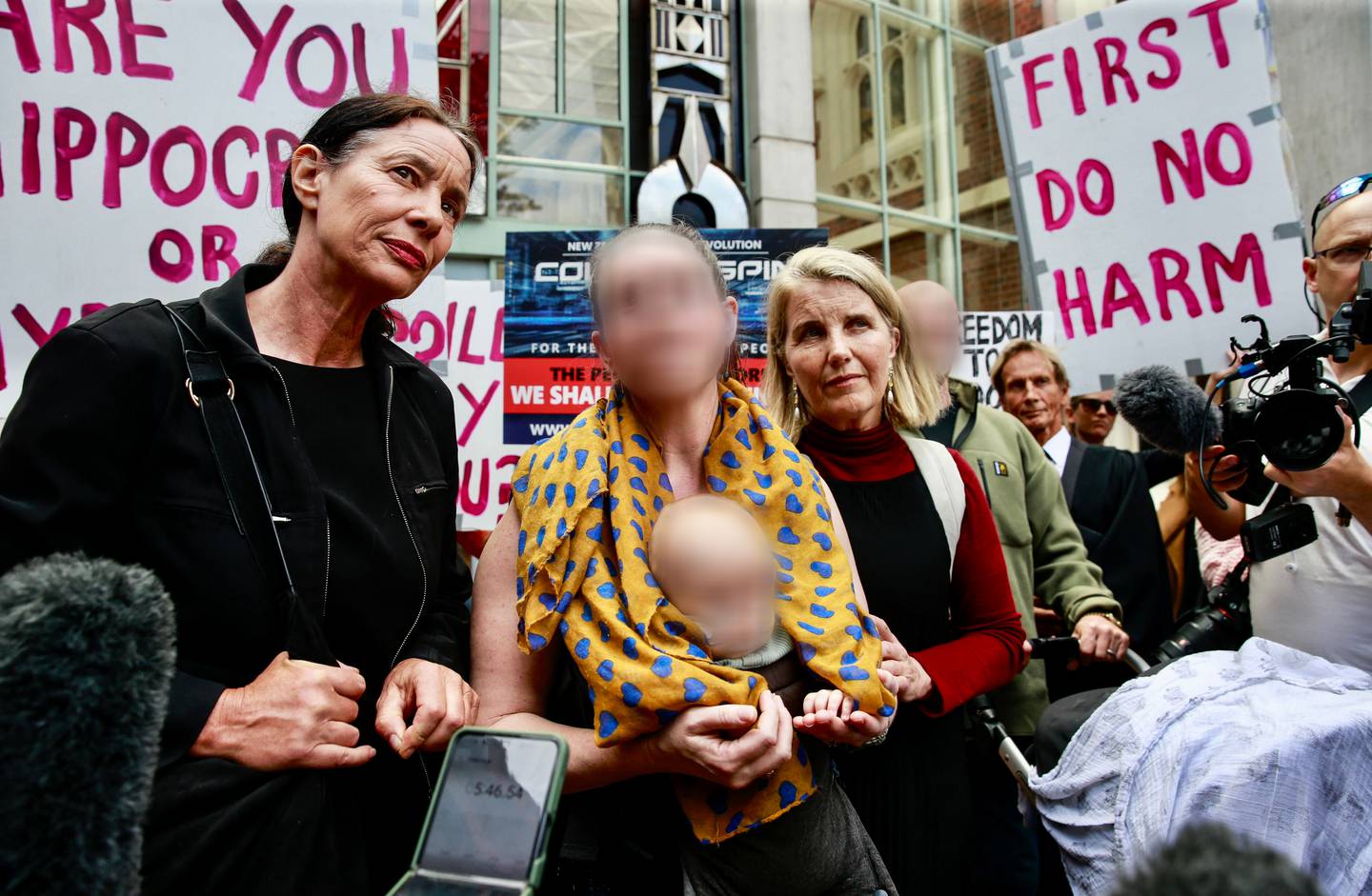 The baby's mother with Liz Gunn (right) and lawyer Sue Grey (left) outside the Auckland High...