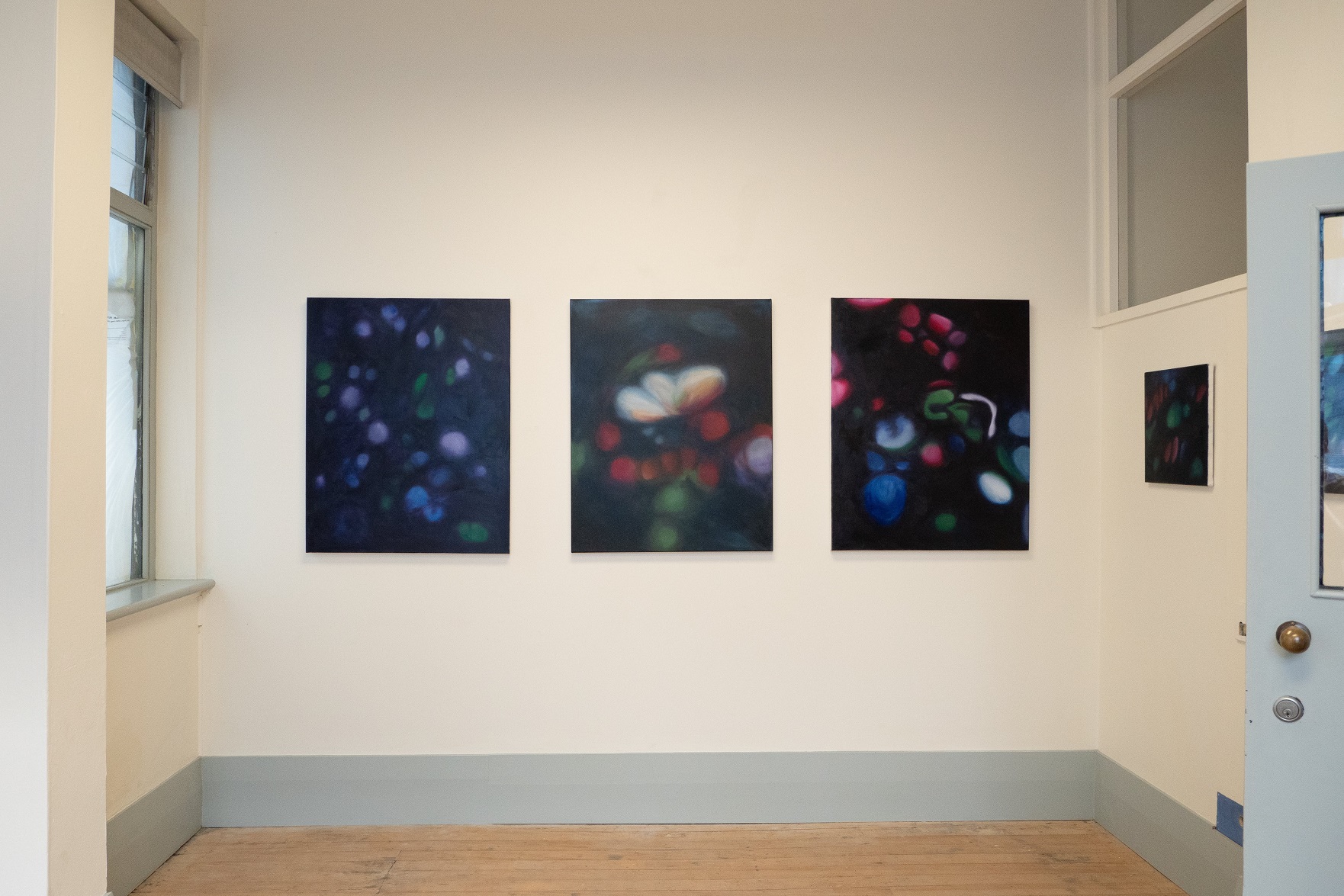 Mason’s work hanging at Wave, from left Woodland Anemone, First Light: Poppy and Burgundy Poppy....