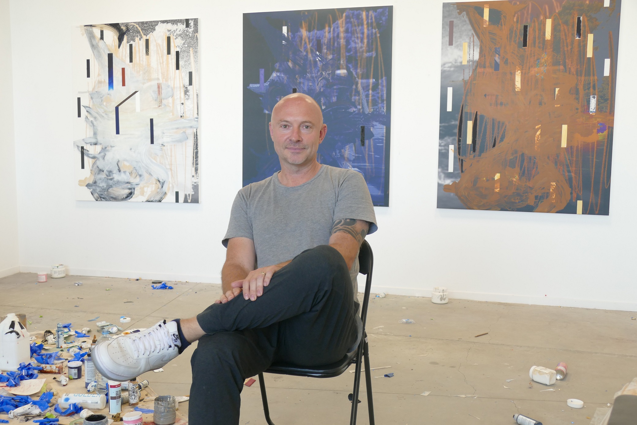 Marc Blake works on his latest paintings in his studio space at Broker, his gallery in Queenstown...