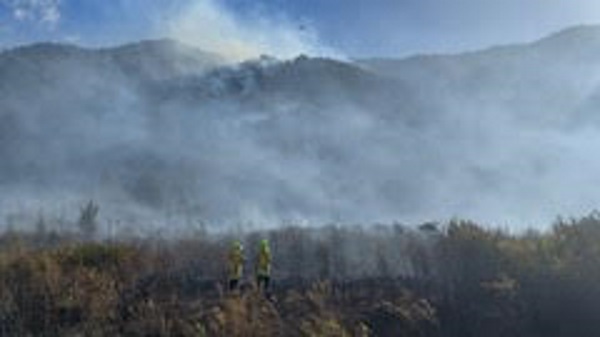 Smoke rises from an inland bush fire bordering the West Coast this week - with the fire risk...