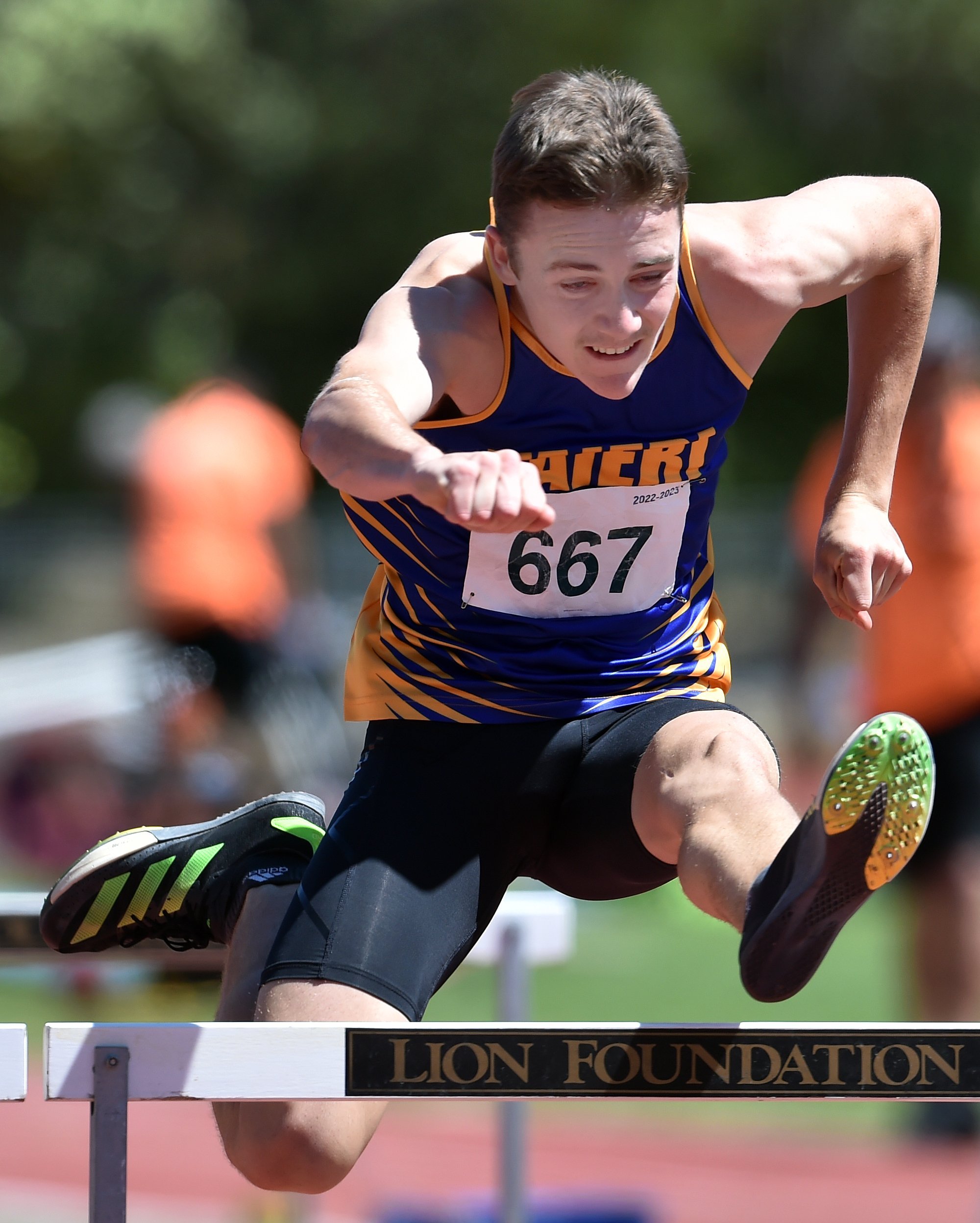 Cole Gibbons, who broke the men’s M18 pole vault record, on his way to winning the 110m hurdles.