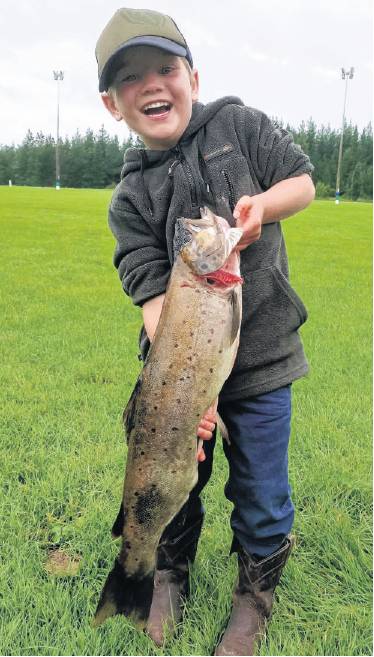 Proud fisher . . . George Lang holds a trout he entered in the Ashley Sport Fishing Club’s Kids...