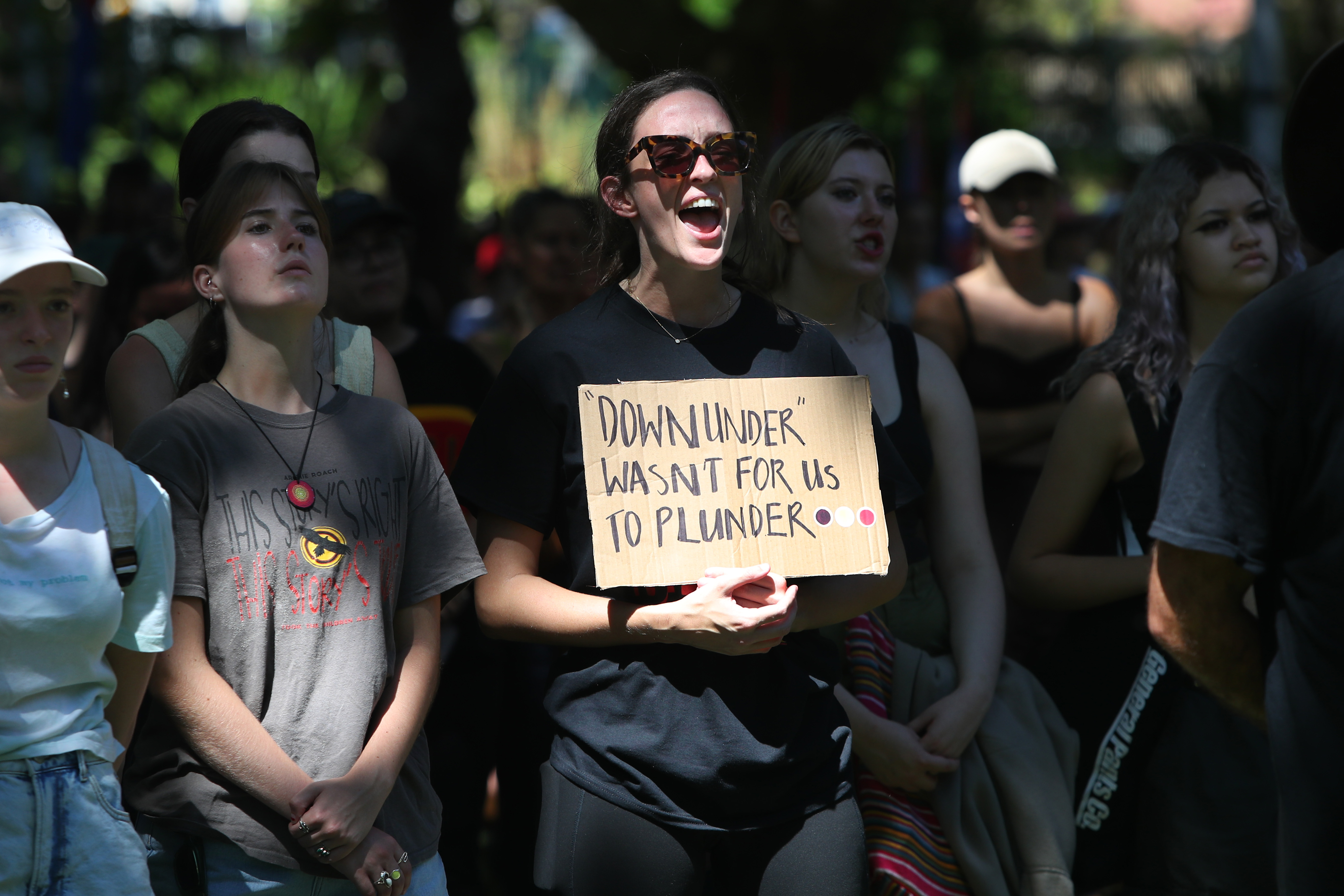 Protesters participate in an Invasion Day protest at Belmore Park on January 26, 2023 in Sydney,...