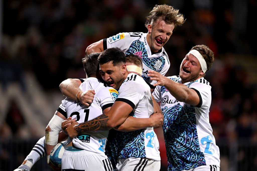 Chiefs players celebrate with Cortez Ratima after he scored a try against the Crusaders. Photo: Getty