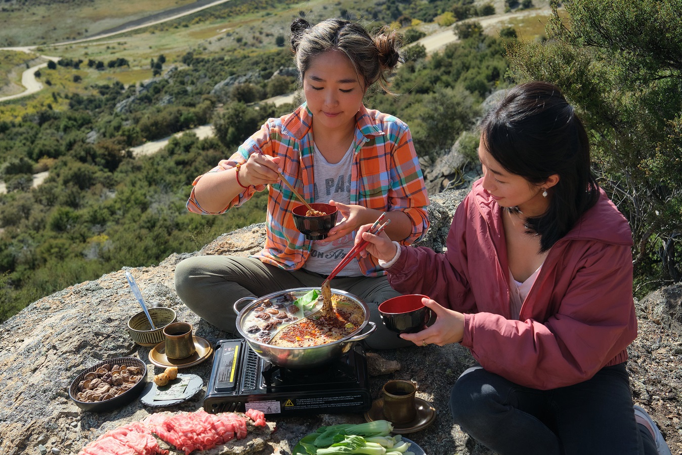 Chinese New Zealander and Central Otago wine maker and entrepreneur Jing Song shares hot pot with...