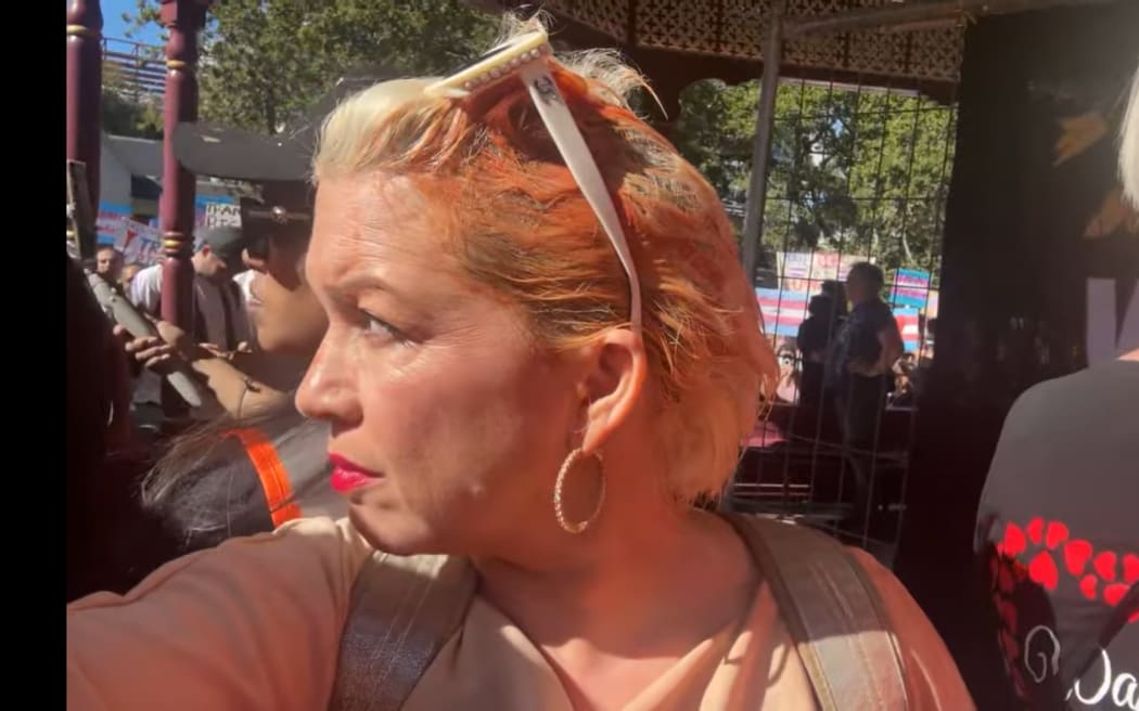 Posie Parker and members of her entourage were pelted with a substance resembling tomato sauce as they made their way to the Albert Park rotunda. Photo: RNZ