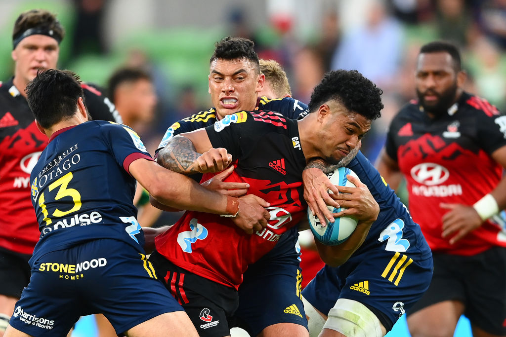 Leicester Fainga'anuku of the Crusaders is tackled during the round two Super Rugby Pacific match...