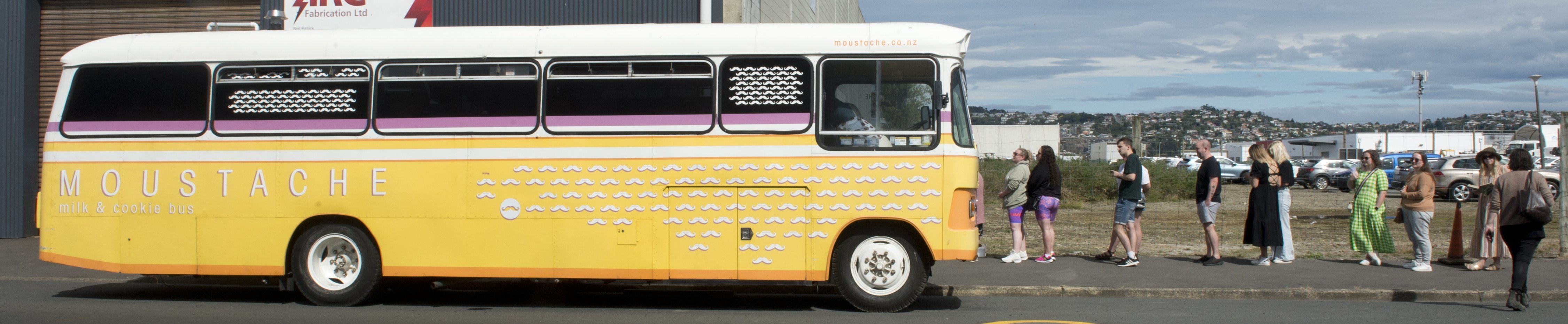 The bus, parked up in Otaki St, and people queueing for a cookie.