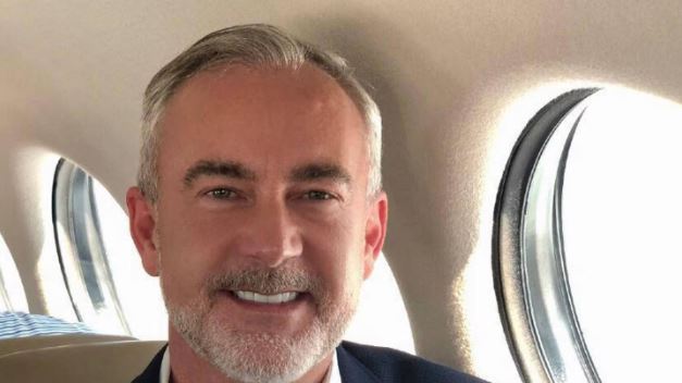 Those allegedly behind an elaborate Tinder scam used this photo of Mark Cain to create an...