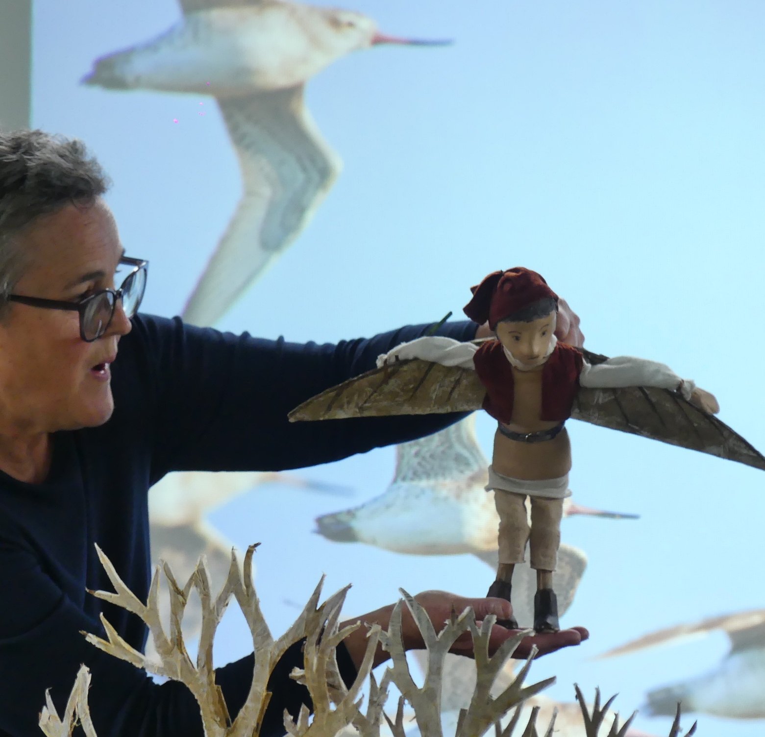 Bridget Sanders helps Jack fly in The Boy with Wings puppet show.