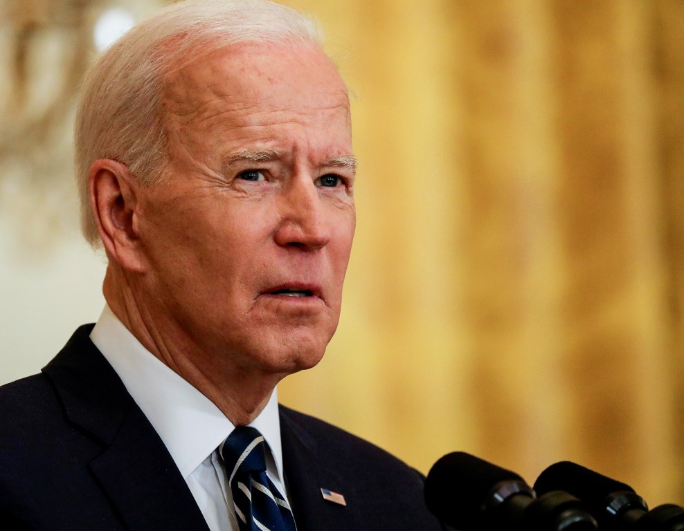 US President Joe Biden speaks during his first formal news conference in the East Room of the...