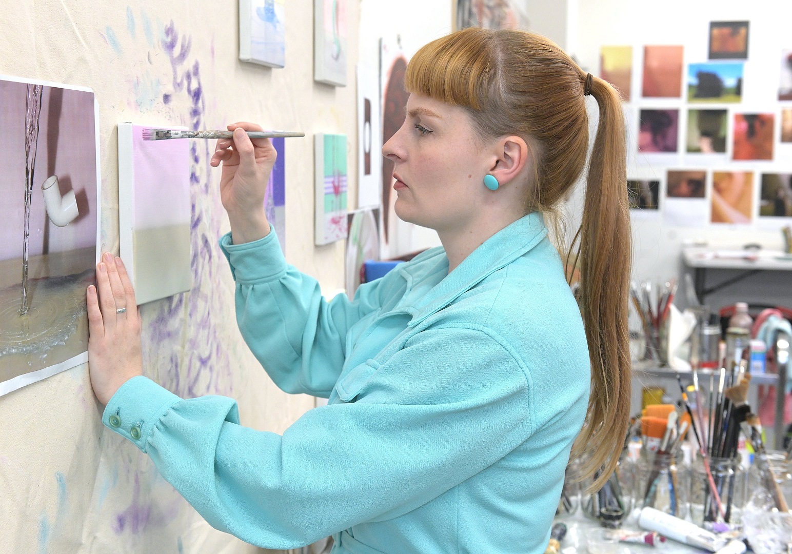 Emily Hartley-Skudder works on one of her paintings in the Frances Hodgkins Fellowship studio....