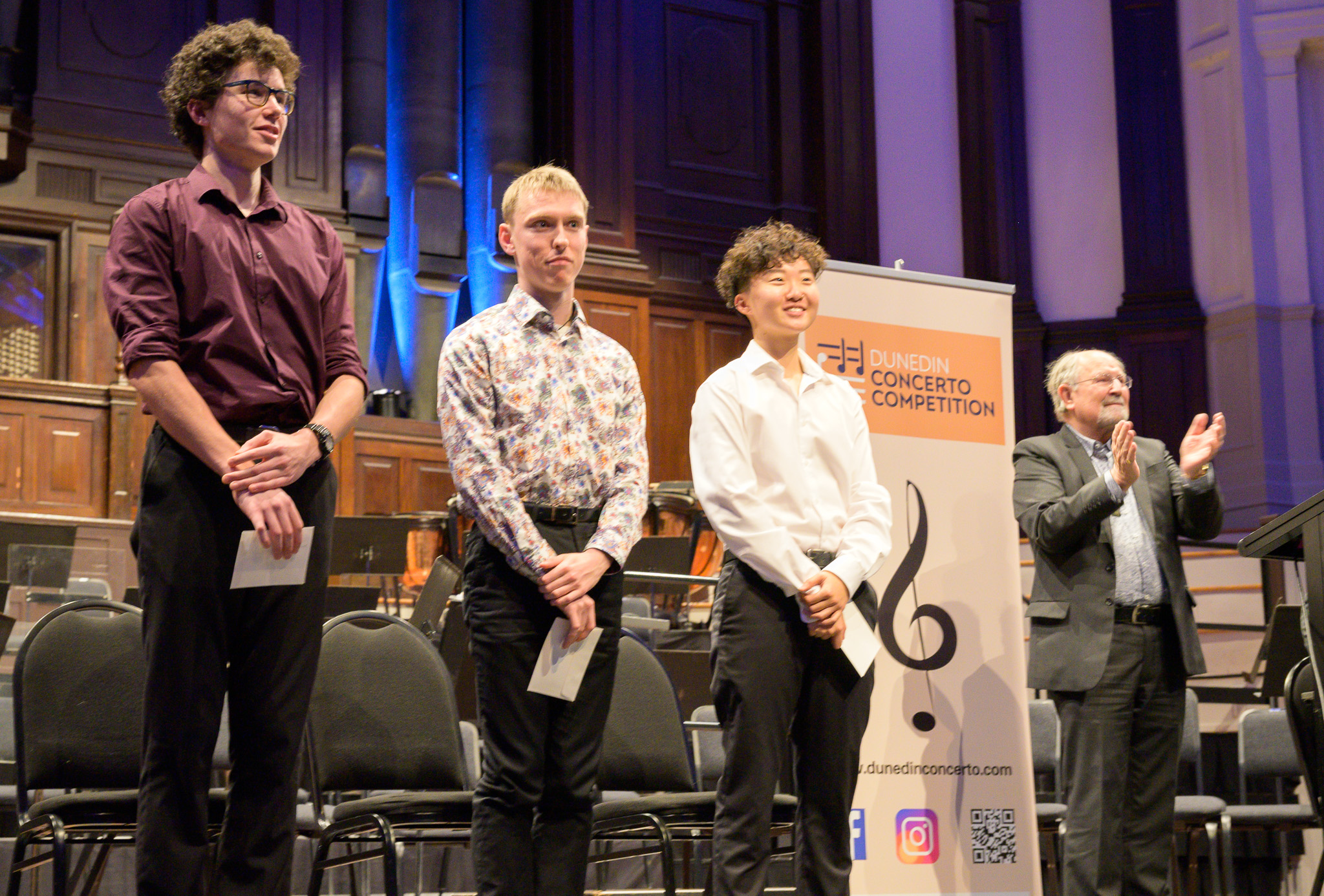 Winners (from left) Boudewijn Keenan, Cameron Monteath and Elio Oh are applauded by Dunedin...